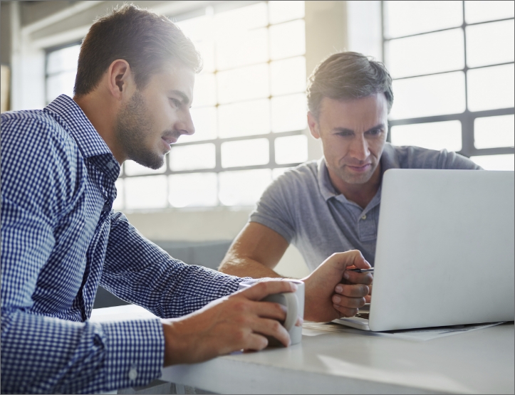 two men using voiceprint on their laptop